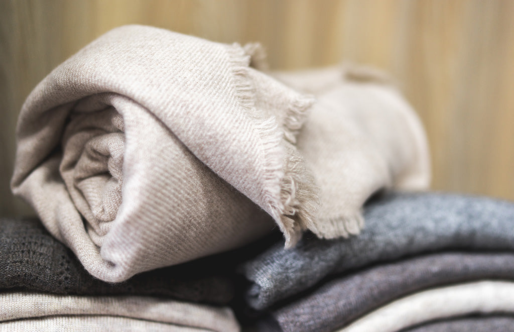 Folded soft knitwear in neutral shades