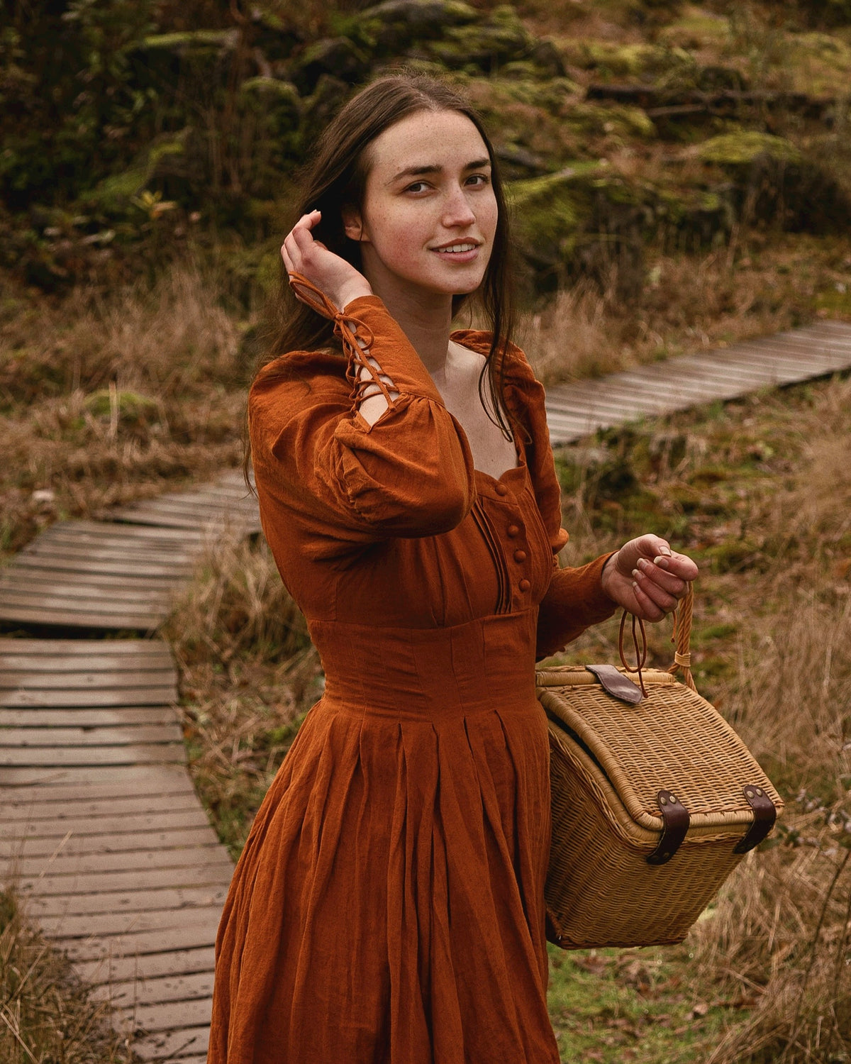 young lady in linen dress with a basket