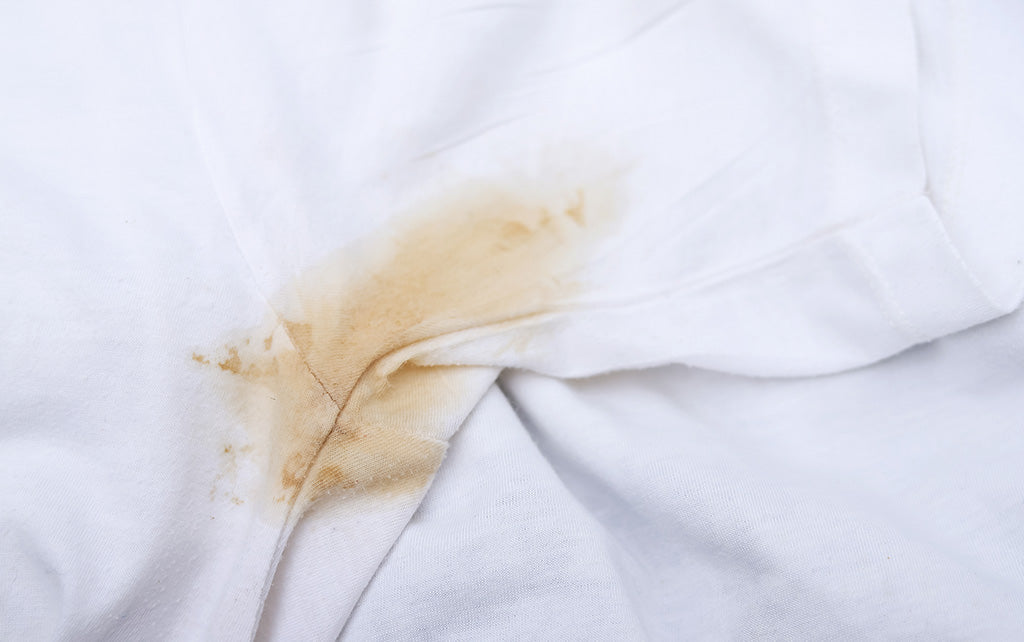 Coffee stain on white linen fabric