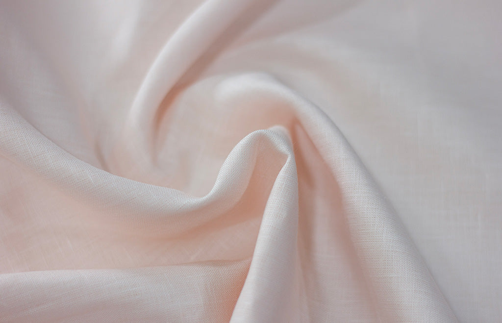 Close-up of soft pink linen fabric