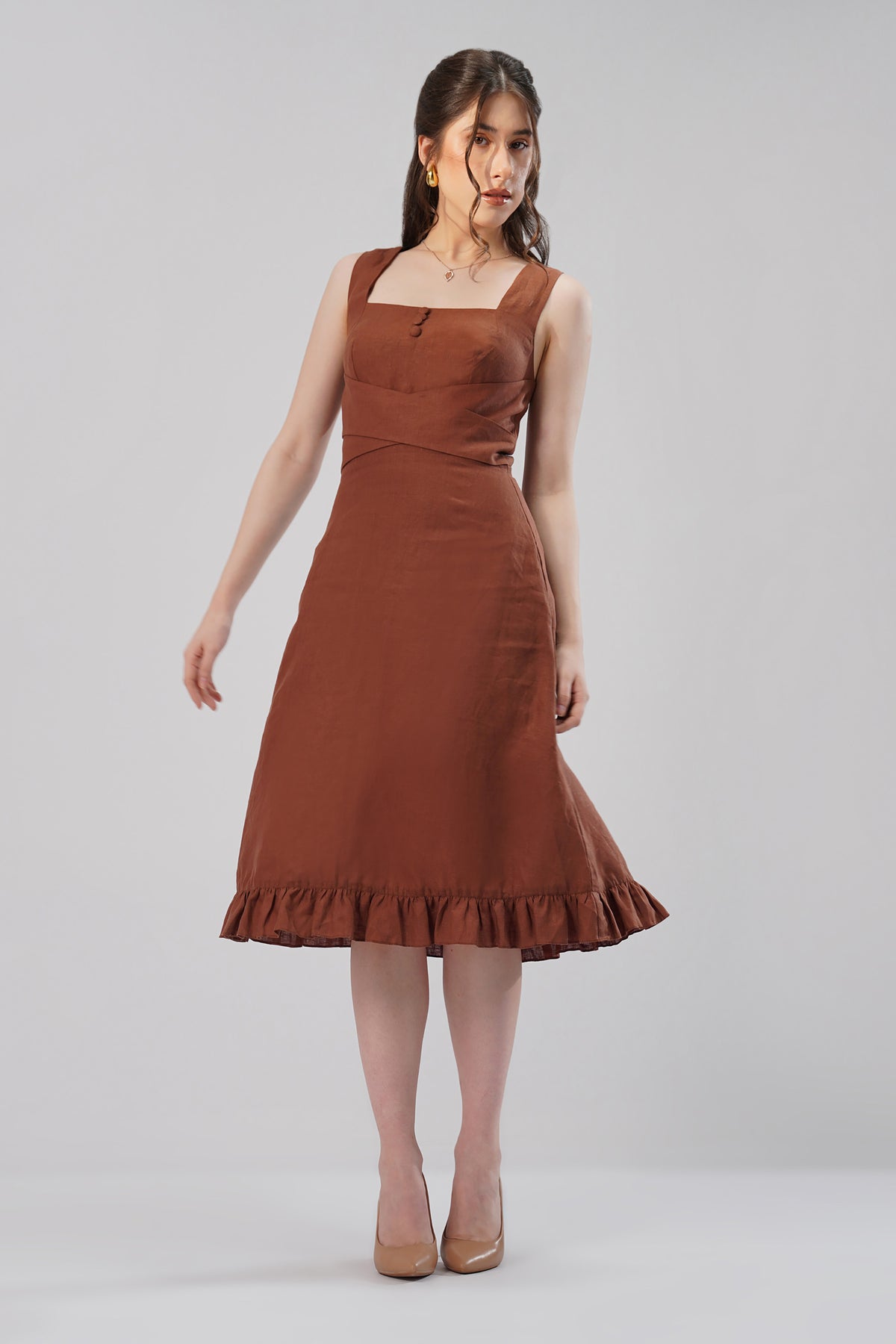 woman wearing brown european linen midi dress front view structured fit