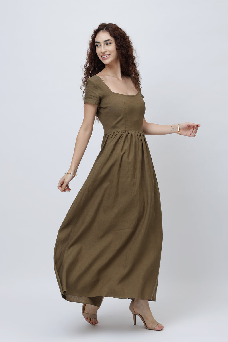 Woman wearing a long olive brown linen maxi skirt dress