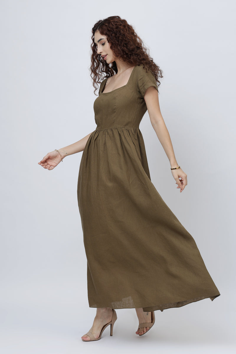 Beautiful woman wearing a long olive brown linen maxi dress