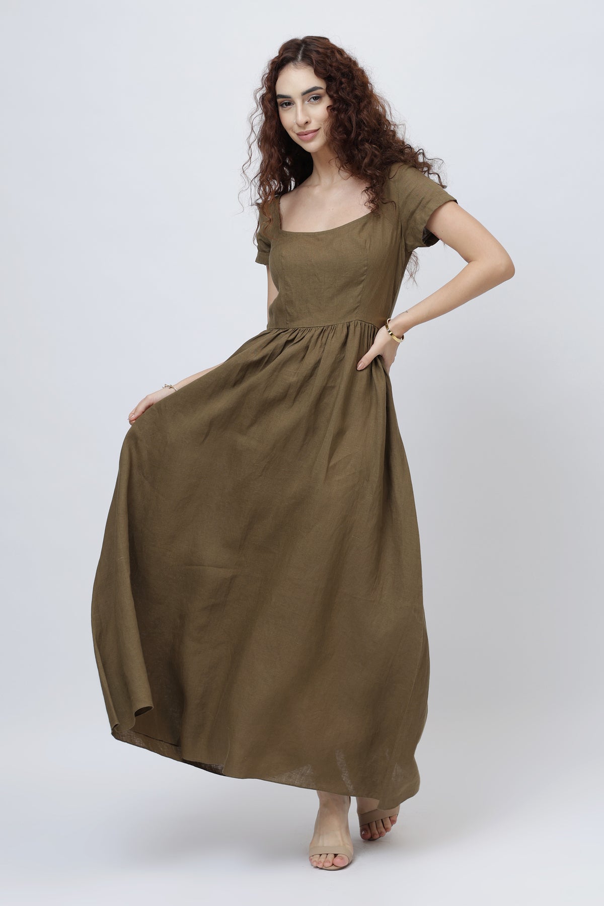 Woman wearing a long olive brown 100% European linen maxi skirt dress 