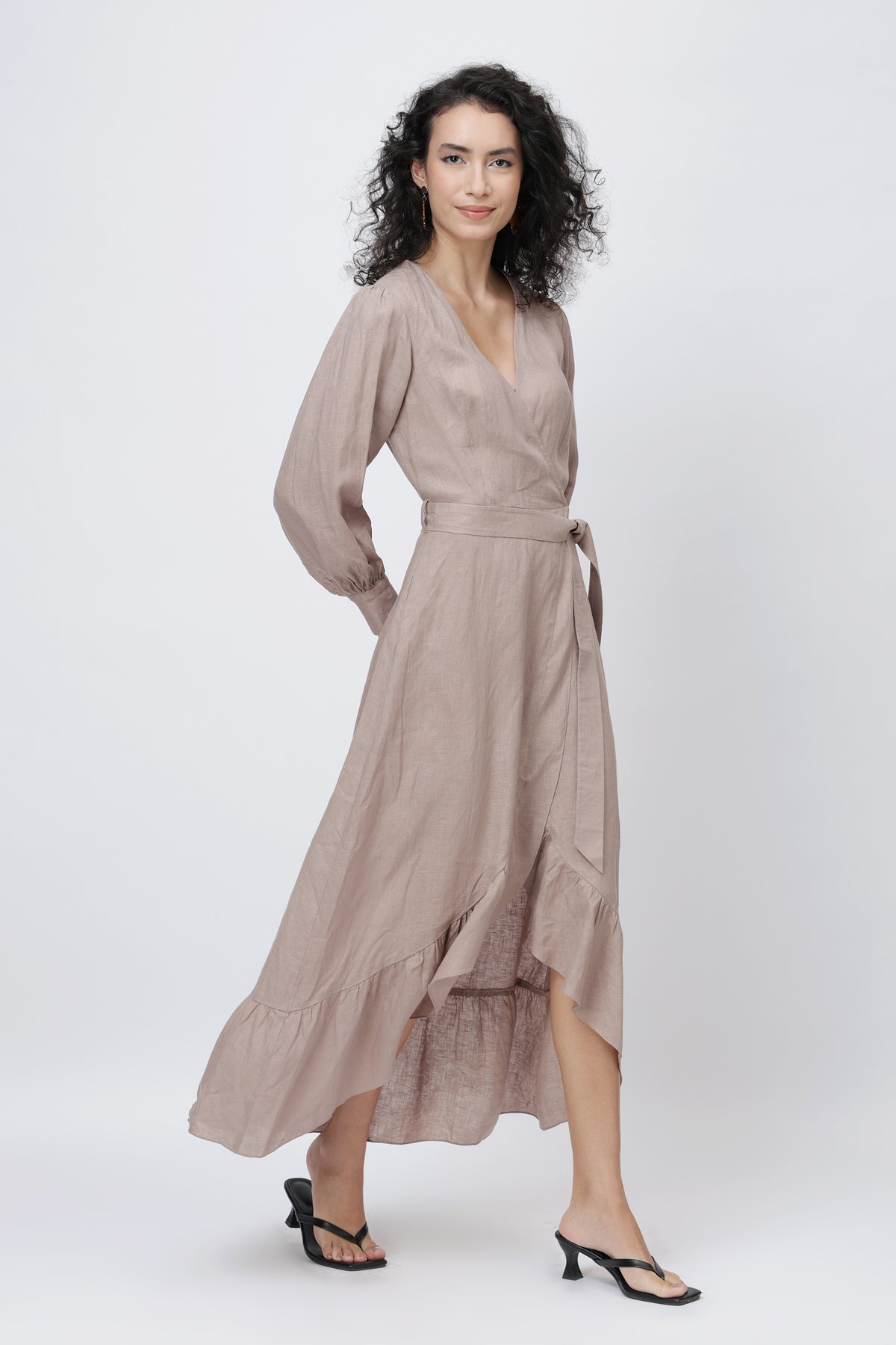 Woman wearing a natural linen wrap dress