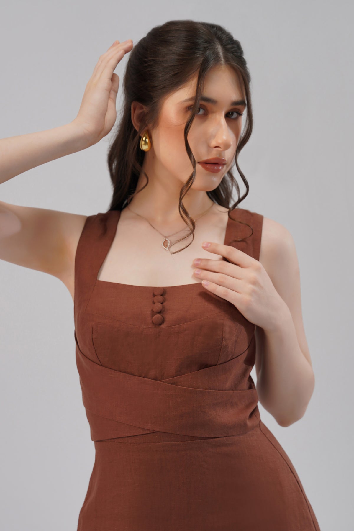 close up square neckline brown linen dress wide straps detail