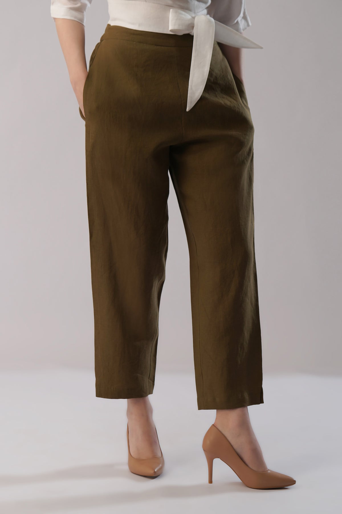lady wearing european linen pants with a white top
