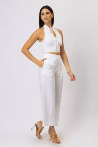 White linen halter top paired with linen trousers