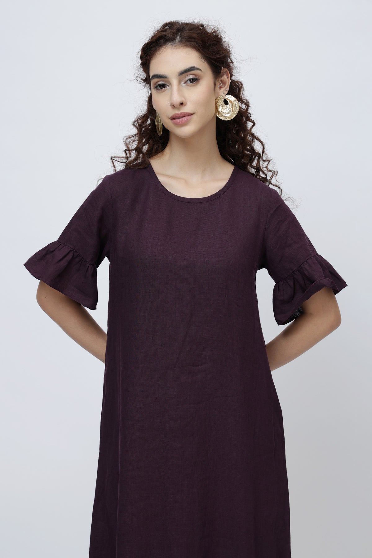 women wearing linen midi dress with ruffle sleeves