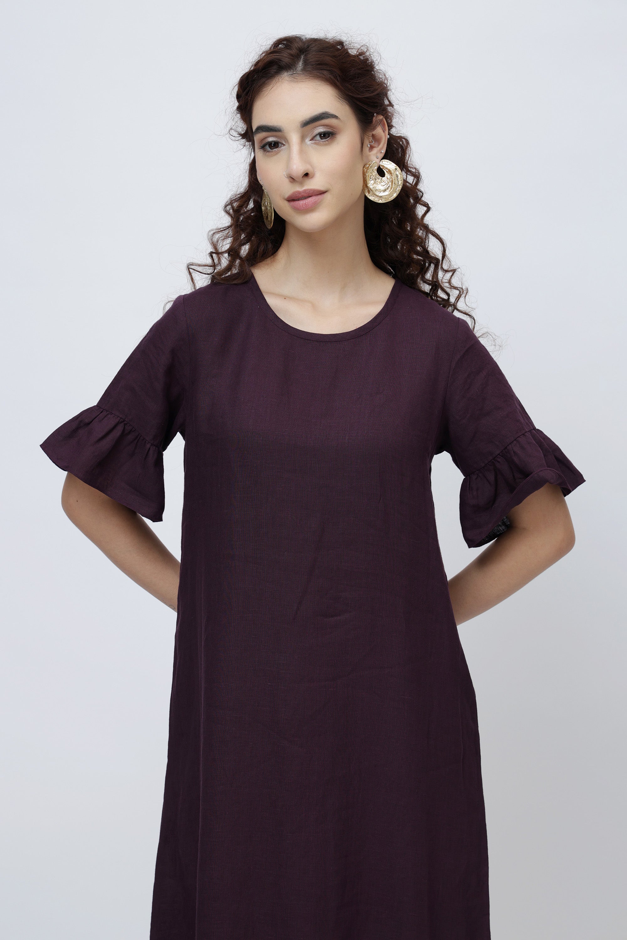 women wearing linen midi dress with ruffle sleeves