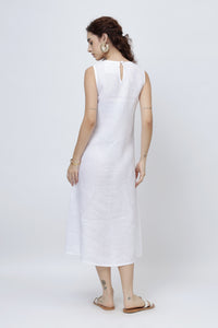 Woman wearing a white sleeveless dress on a white background