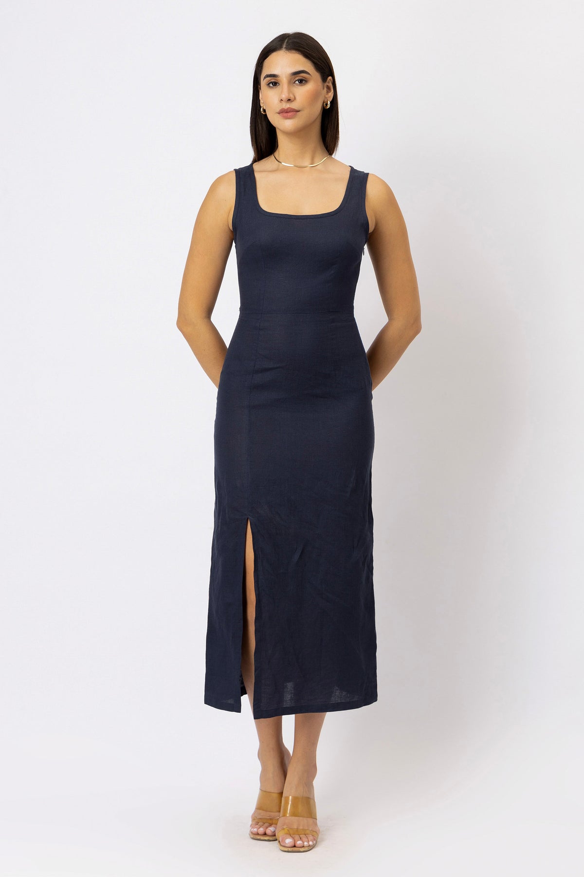 European linen midi dress with square neckline, fitted waist, side slit, and sleeveless design