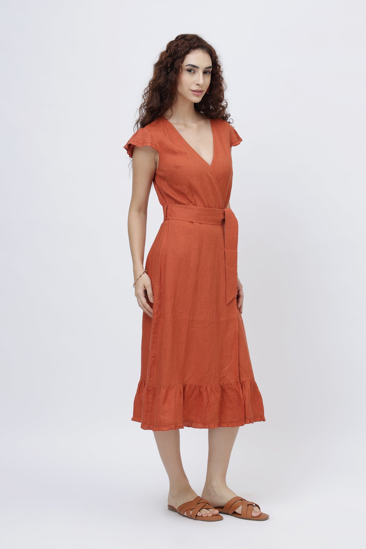 young woman in European linen wrap dress