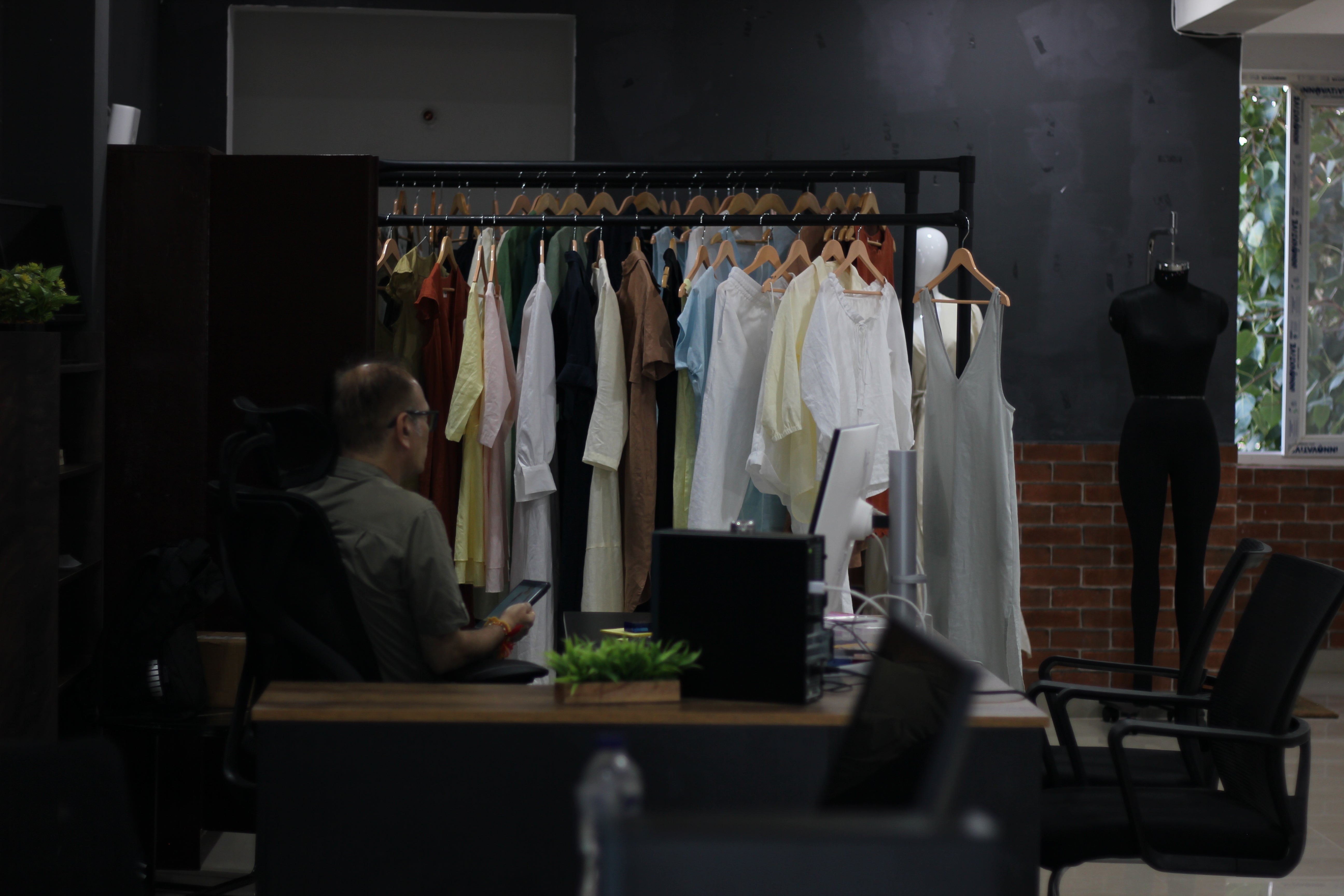 Women’s white and pastel yellow linen mini dresses in studio setting