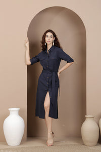 Woman in a midnight blue linen shirt dress