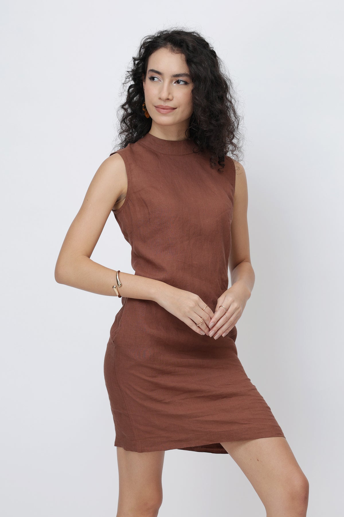 Woman wearing a brown linen shift dress