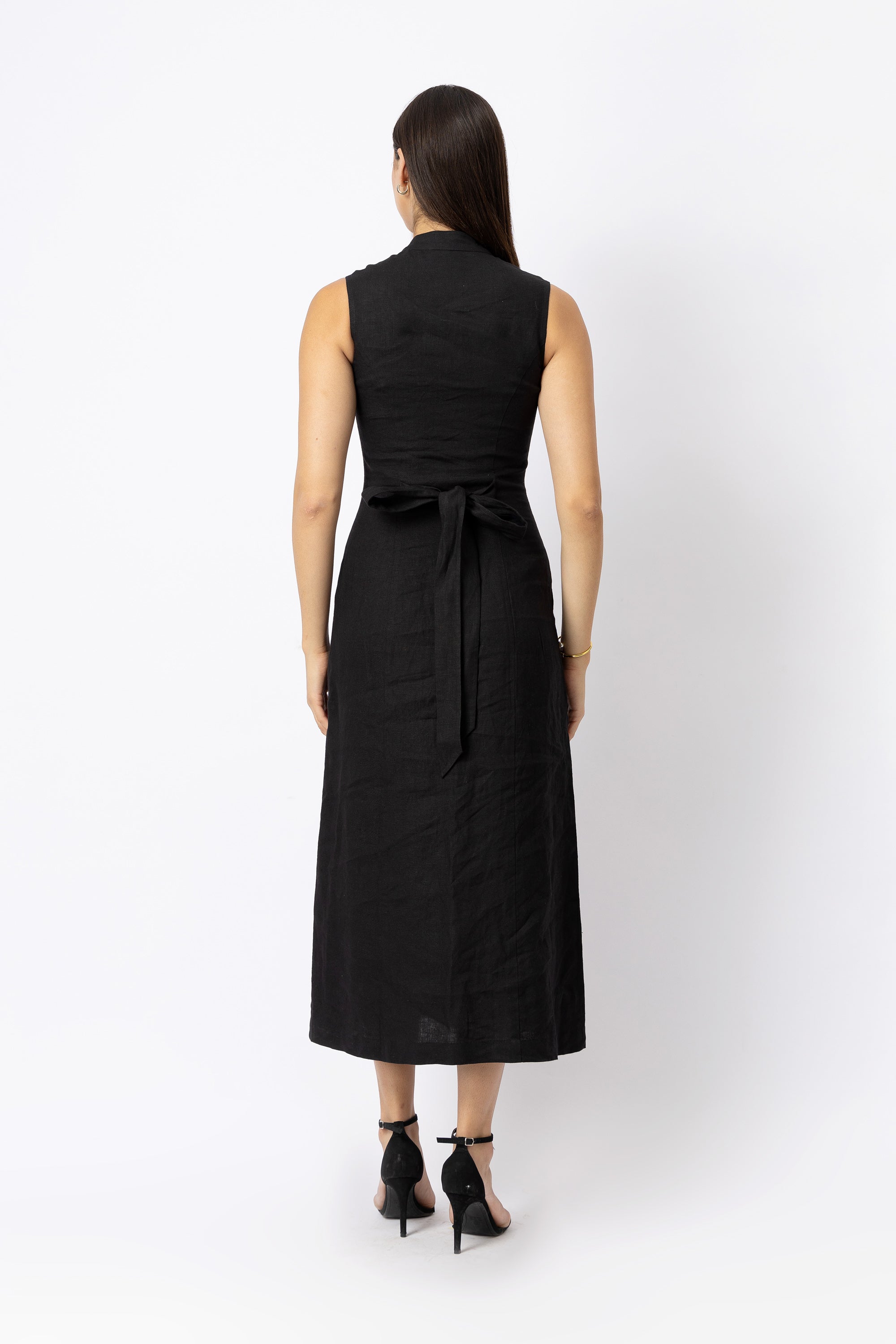 Back view of black linen midi dress with adjustable waist tie