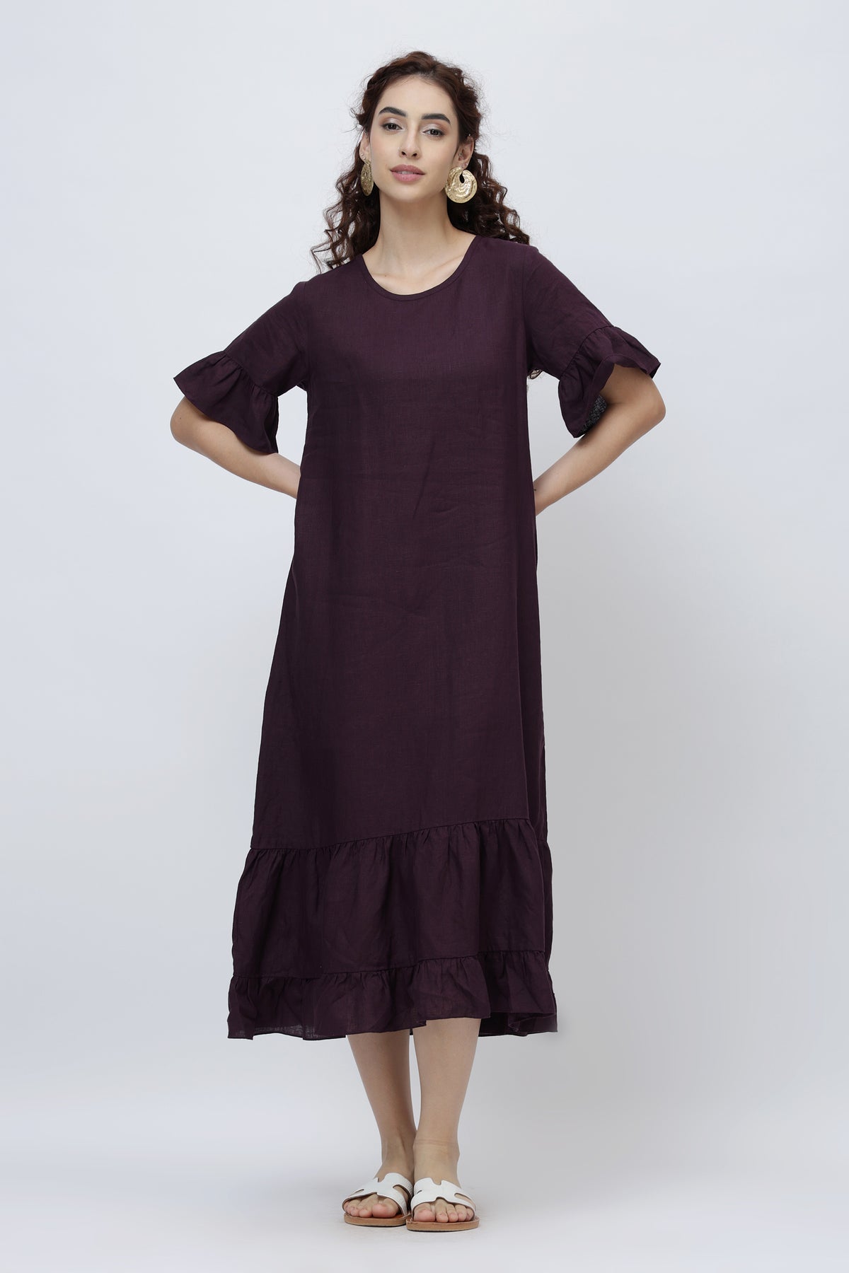 young women in relaxed linen summer dress with tiered hem