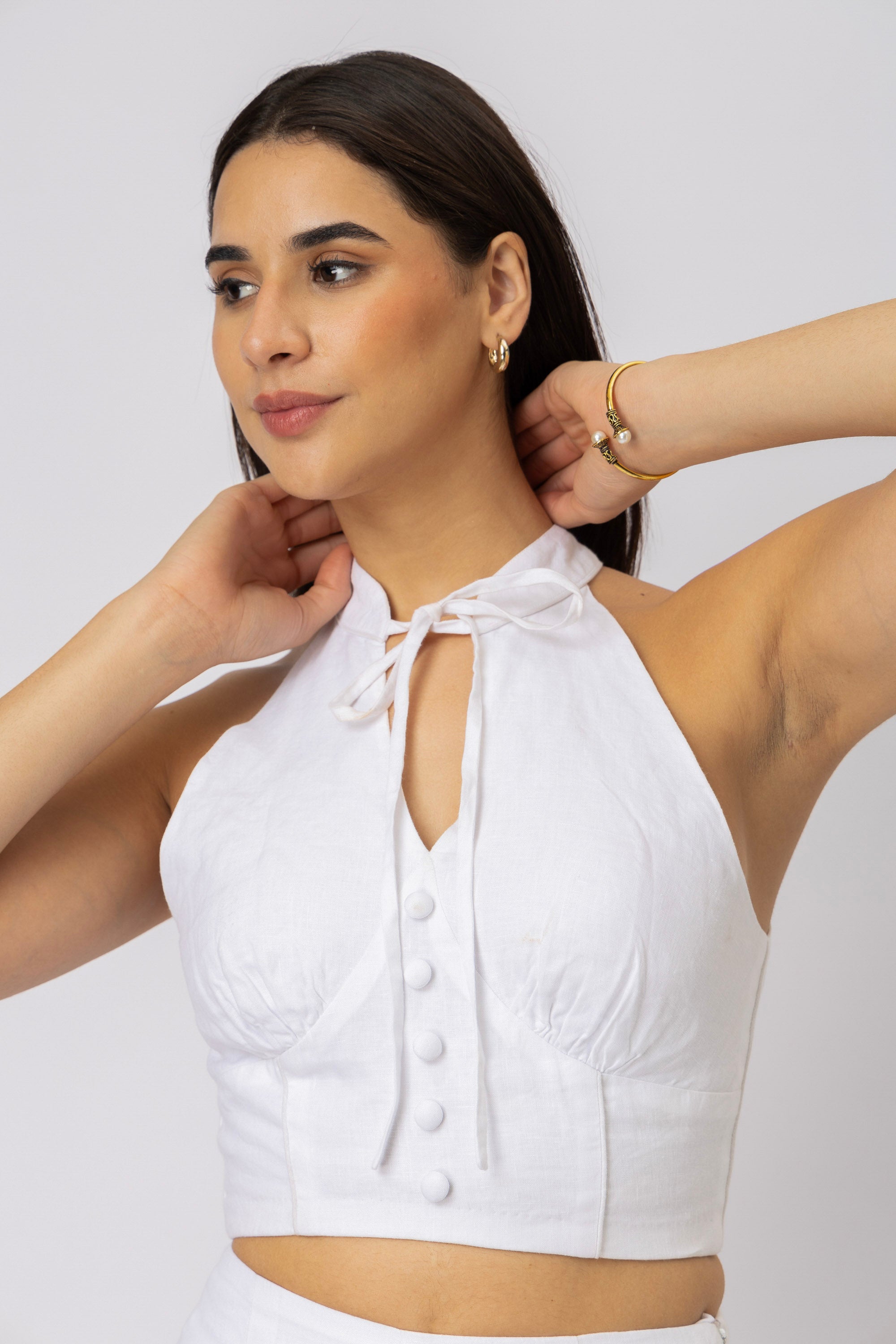 White linen top featuring fabric-covered buttons