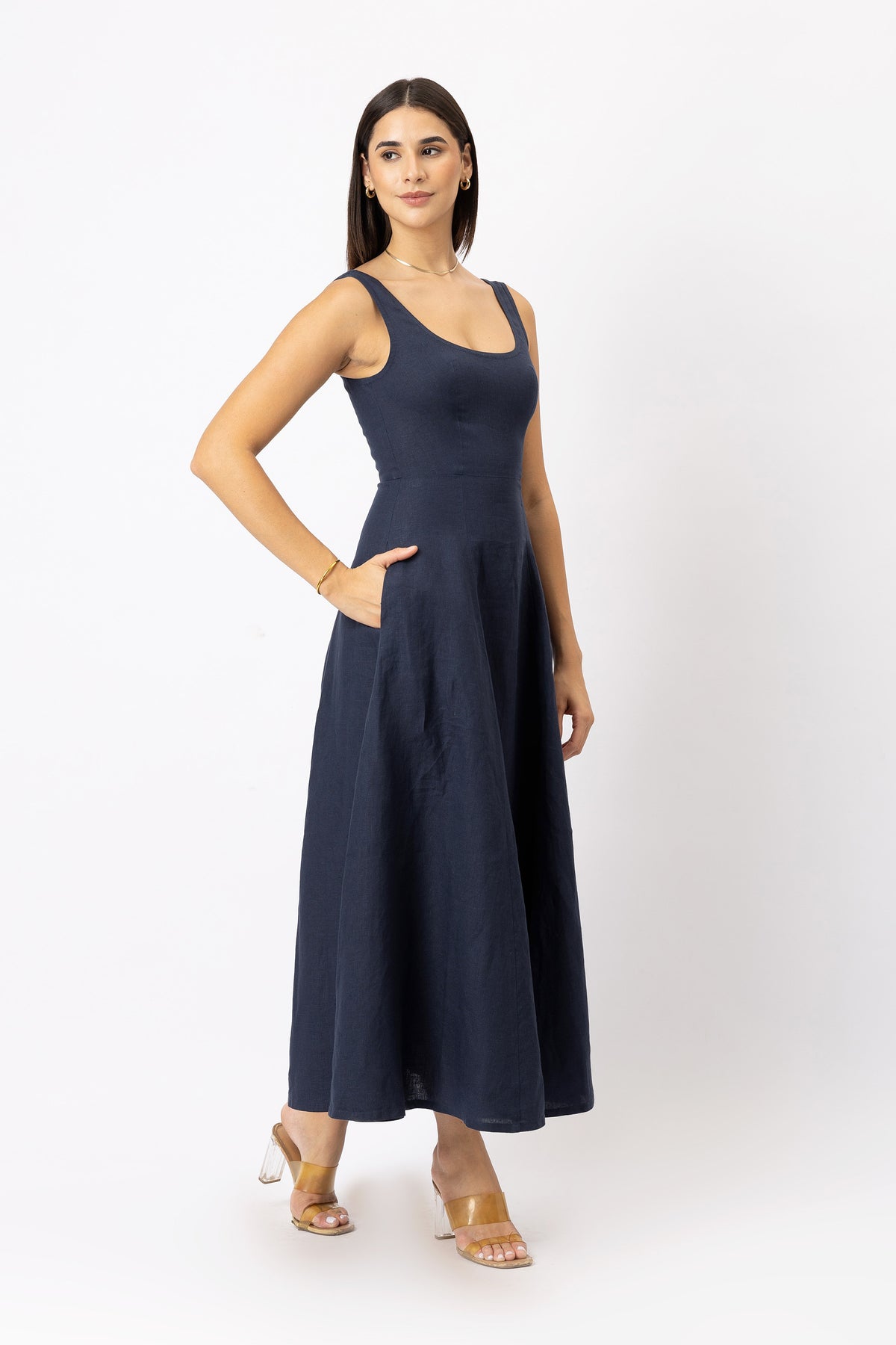 Woman wearing a navy blue sleeveless linen maxi dress