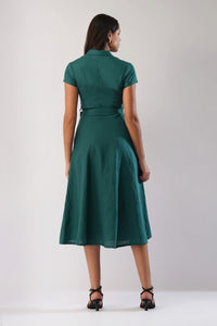Back view of a linen midi dress with short sleeves, waist tie and flared A-line skirt