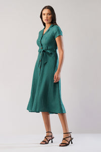 Side view of a linen midi dress with notched collar, short sleeves, button front and waist tie