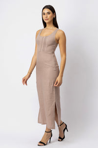 Natural linen sleeveless midi dress with scoop neckline, fitted silhouette, vertical pintuck detailing, and side slit