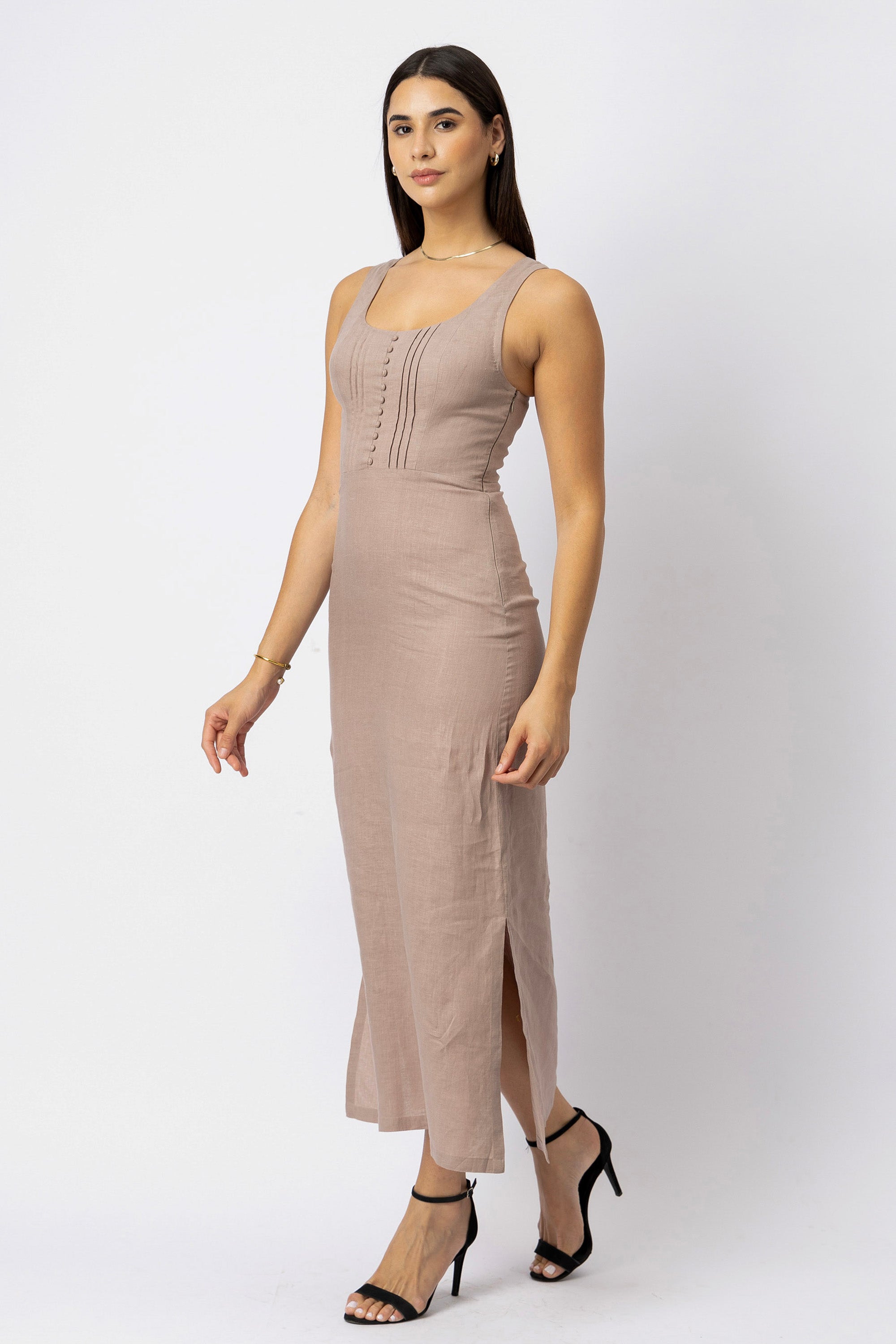 Natural linen sleeveless midi dress with scoop neckline, fitted silhouette, vertical pintuck detailing, and side slit
