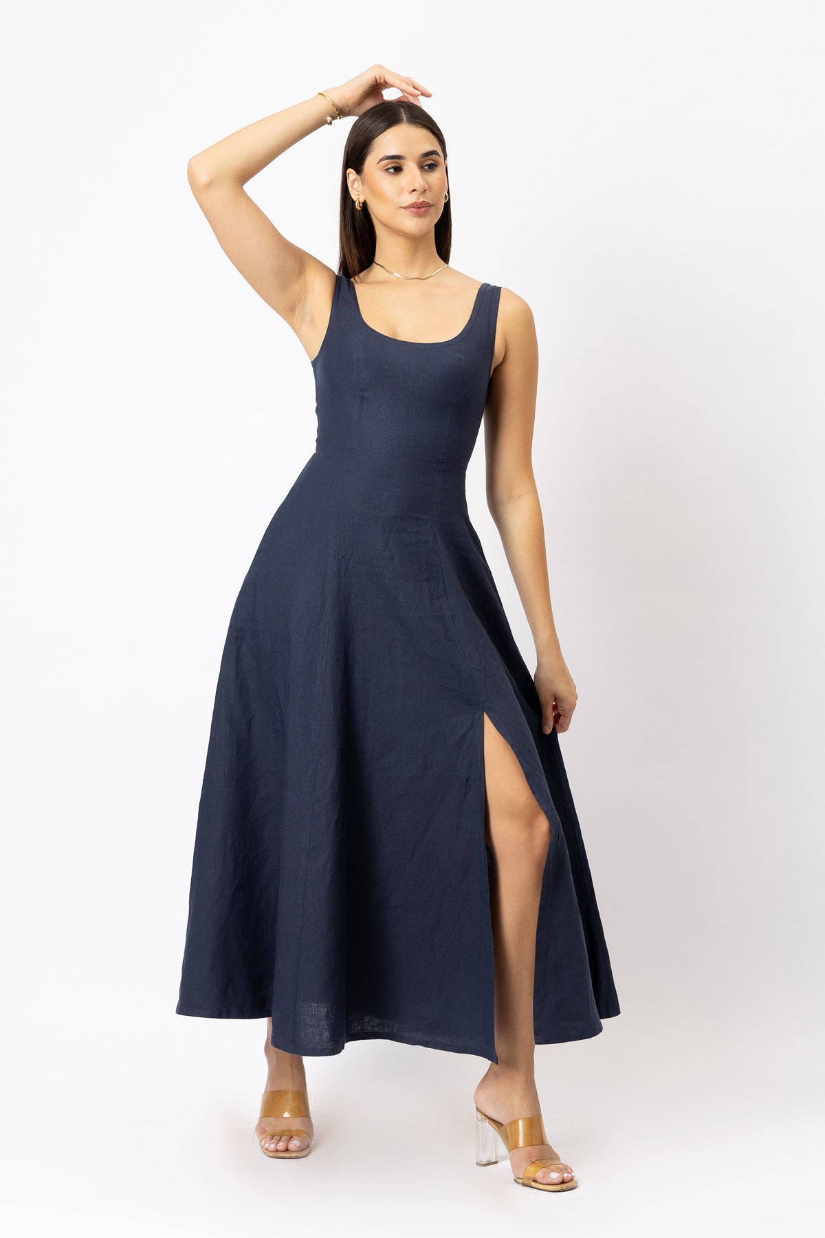 Side slit detail on navy linen maxi dress with flowing A-line skirt