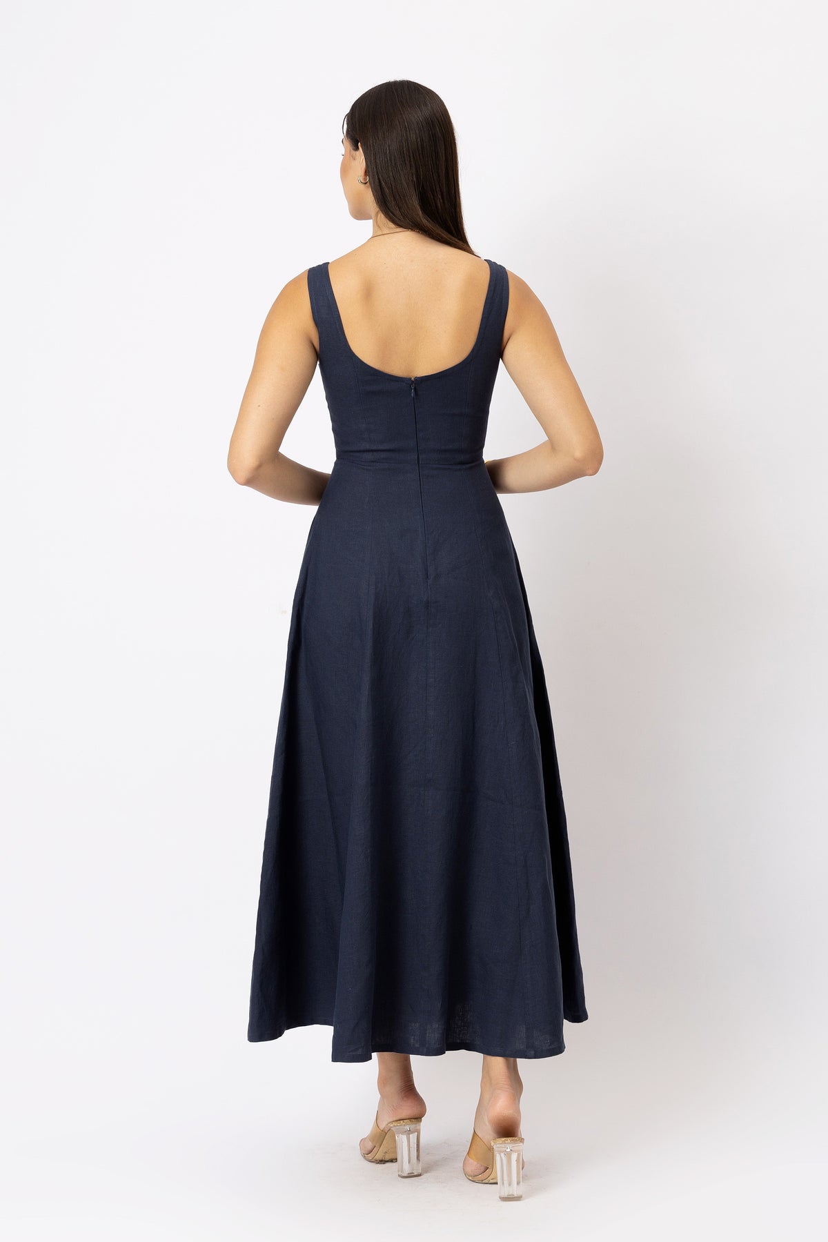 Back view of sleeveless linen maxi dress with scoop back and A-line skirt
