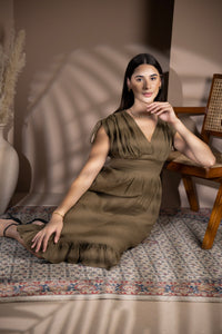 Woman wearing a European linen midi dress indoors