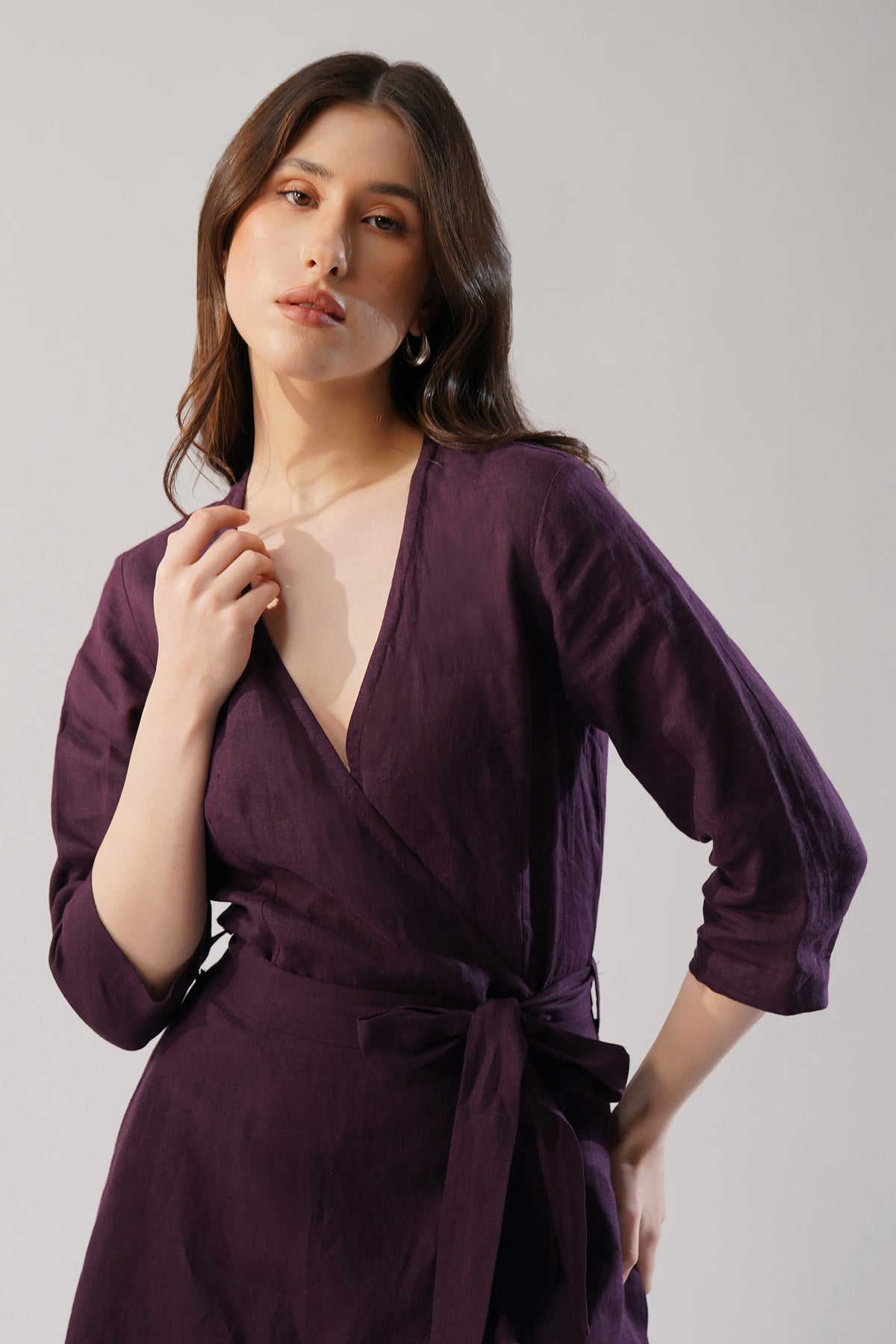 plum linen wrap dress with tie waist and flowing silhouette