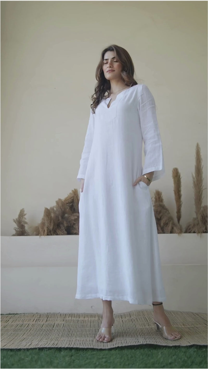 female fashion model wearing white linen kaftan dress