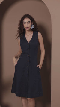beautiful young lady in linen button-down sleeveless dress
