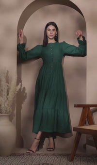 lady in dark jade linen tiered dress 