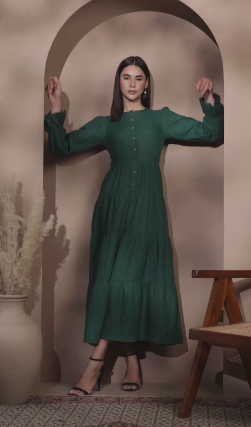 lady in dark jade linen tiered dress 