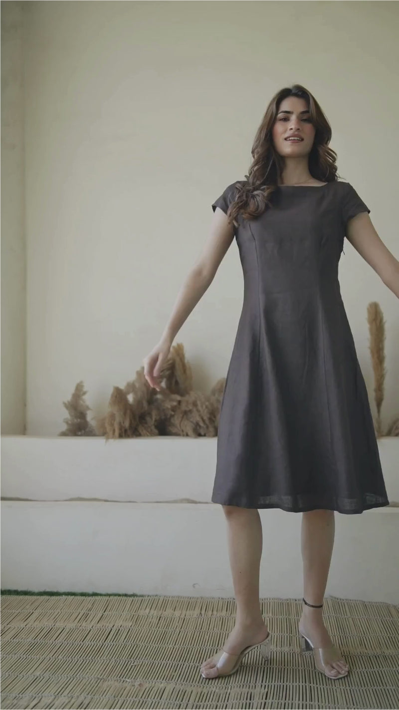 video of a female model wearing Kuttons brown linen dress