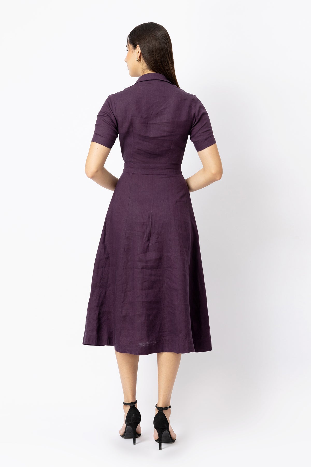 Back view of linen midi dress with short sleeves, defined waist and A-line skirt