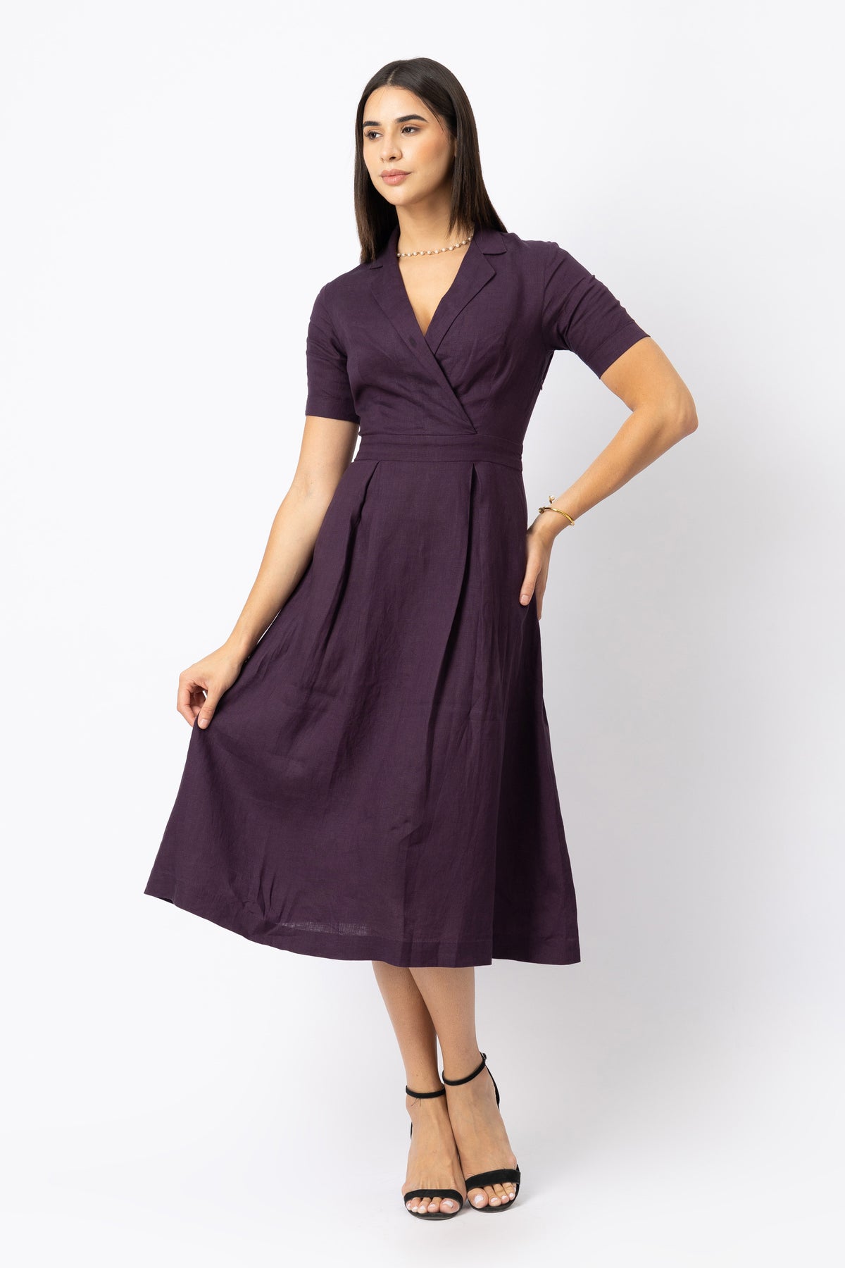 Woman wearing a purple European linen dress
