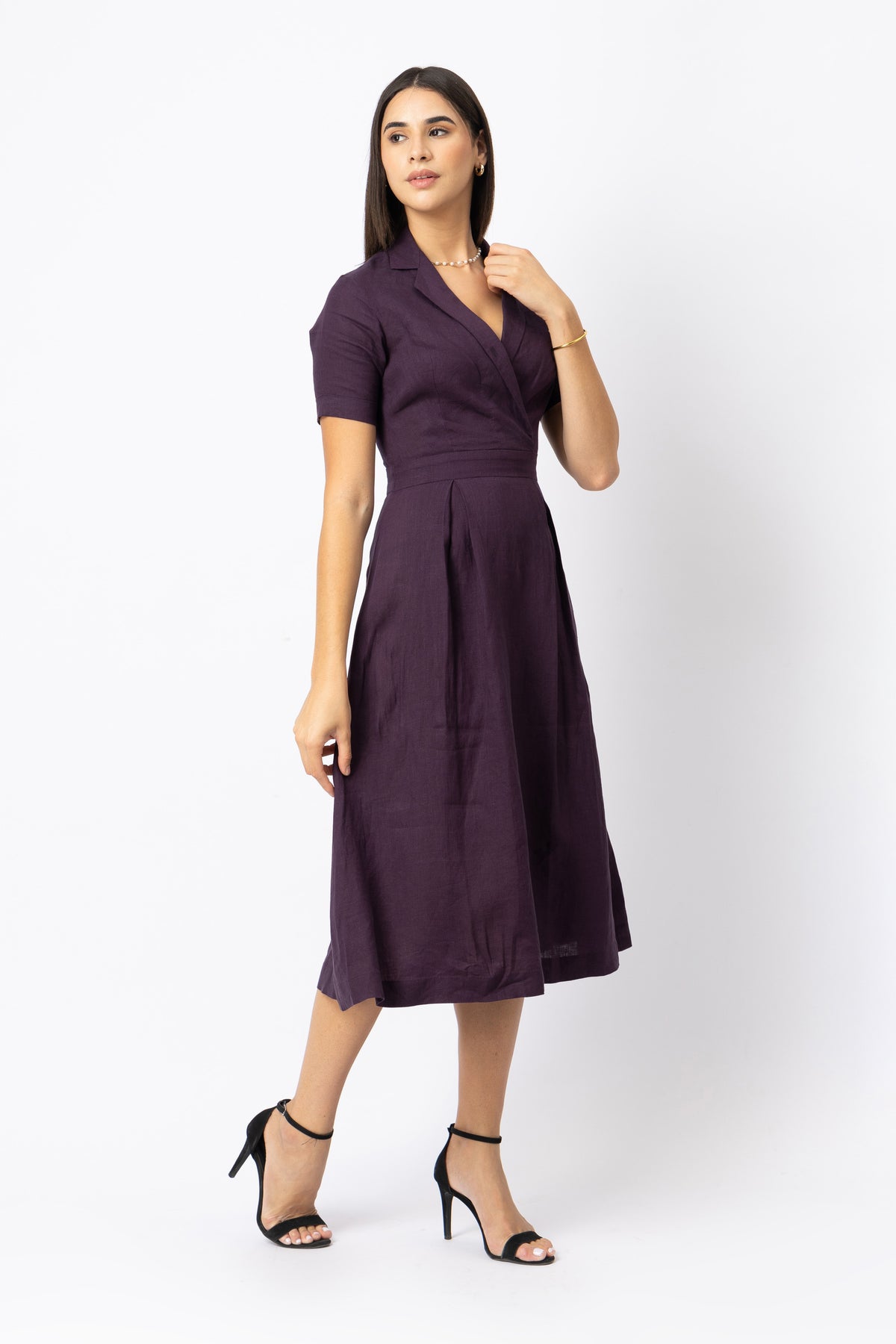 Soft pleated A-line skirt detail on purple linen midi dress