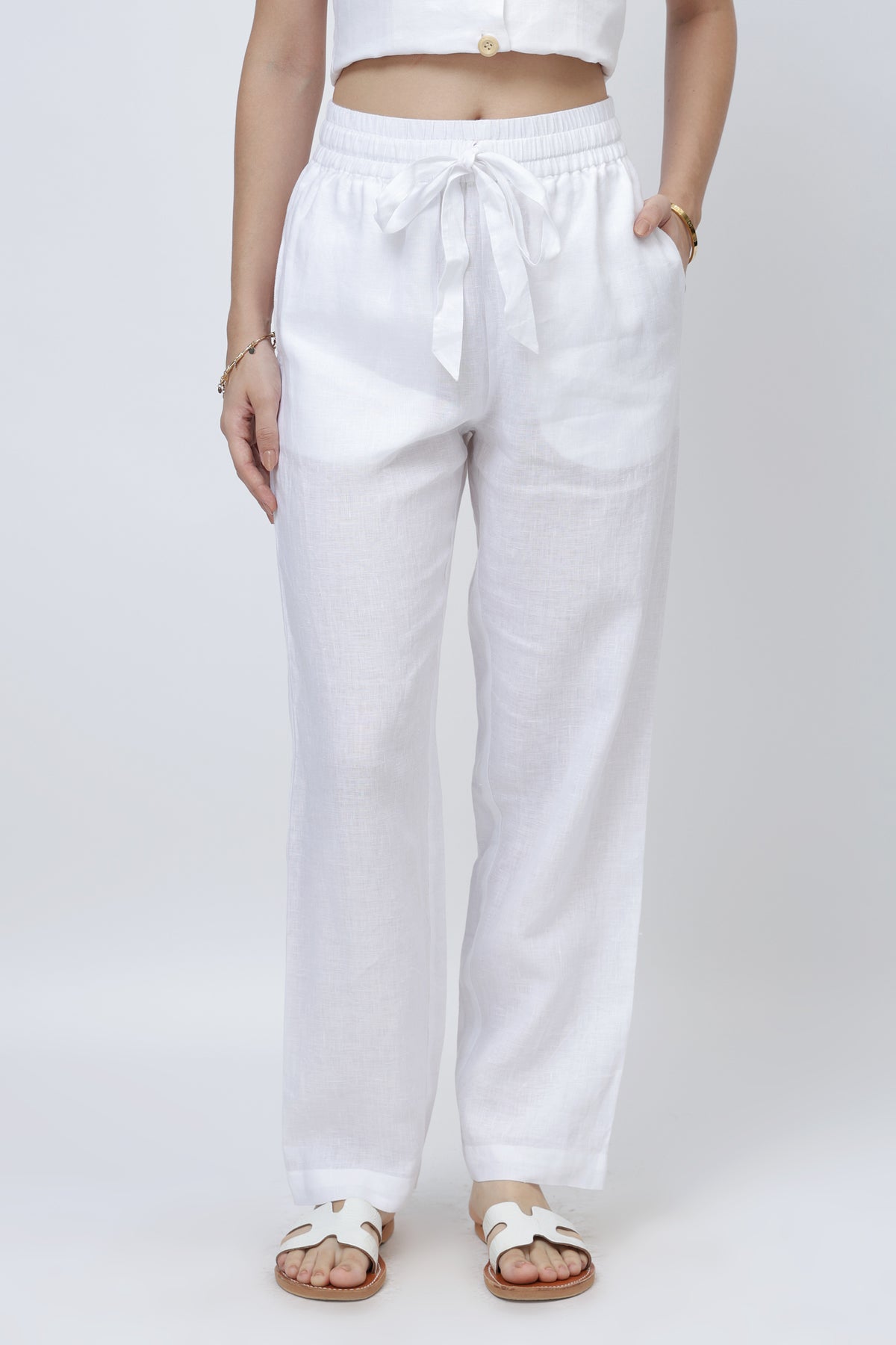 Women’s white relaxed linen pants with elastic waistband and drawstring, straight leg fit