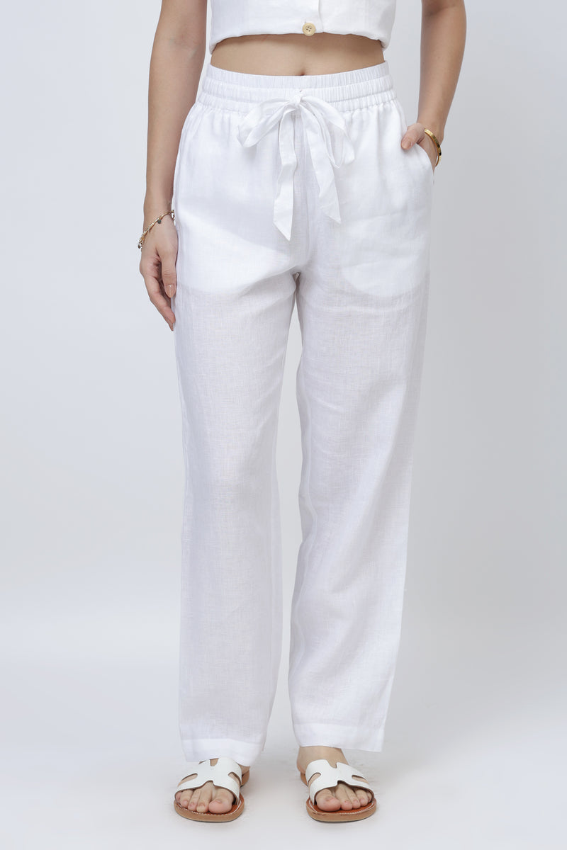 Women’s white relaxed linen pants with elastic waistband and drawstring, straight leg fit