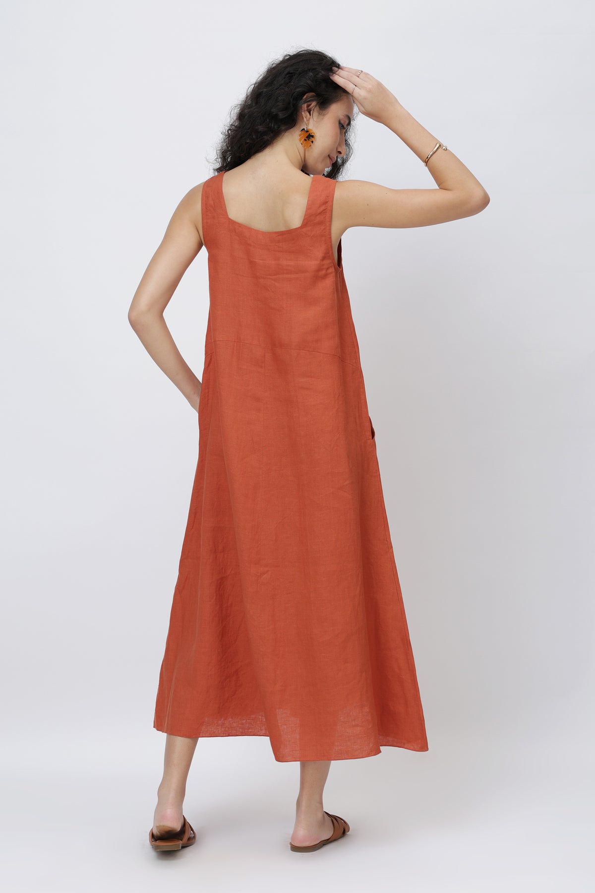 Minimalist sleeveless linen dress back view