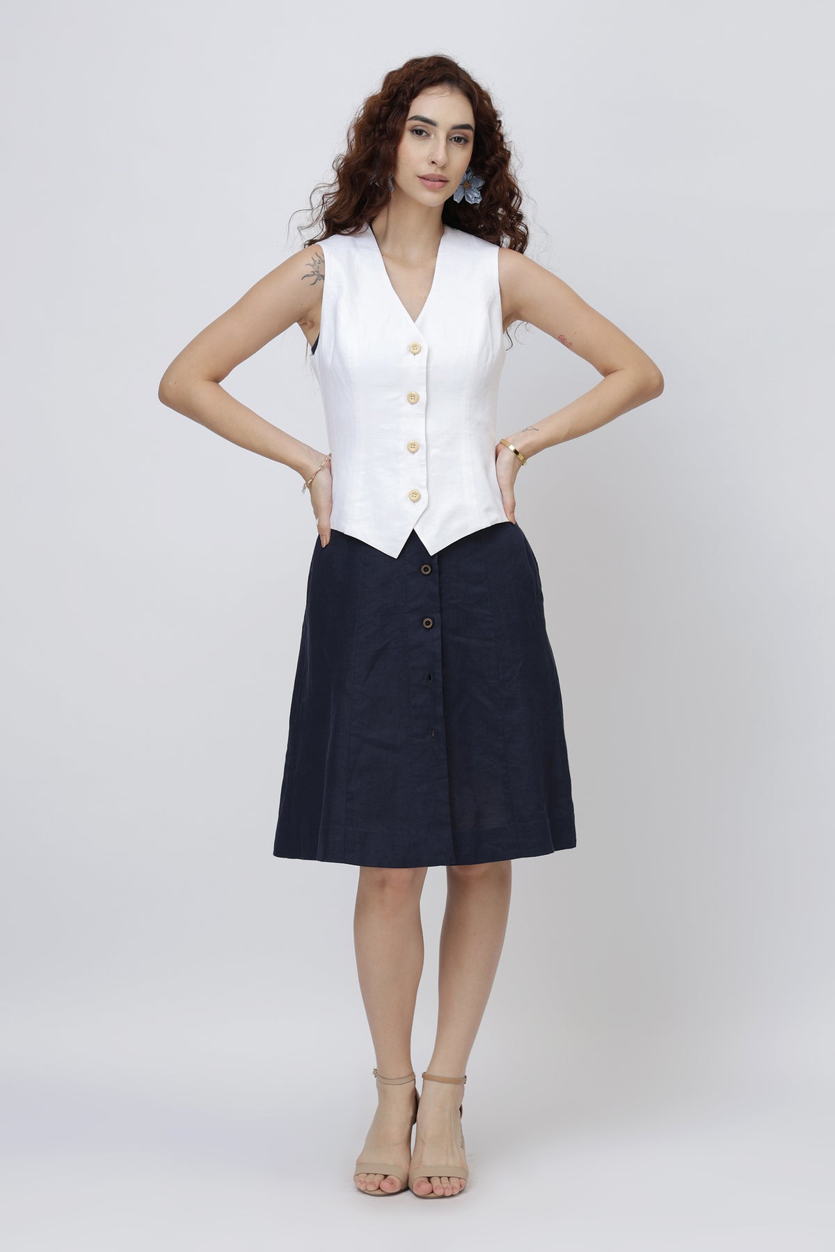 beautiful girl wearing a European linen vest top on a linen dress