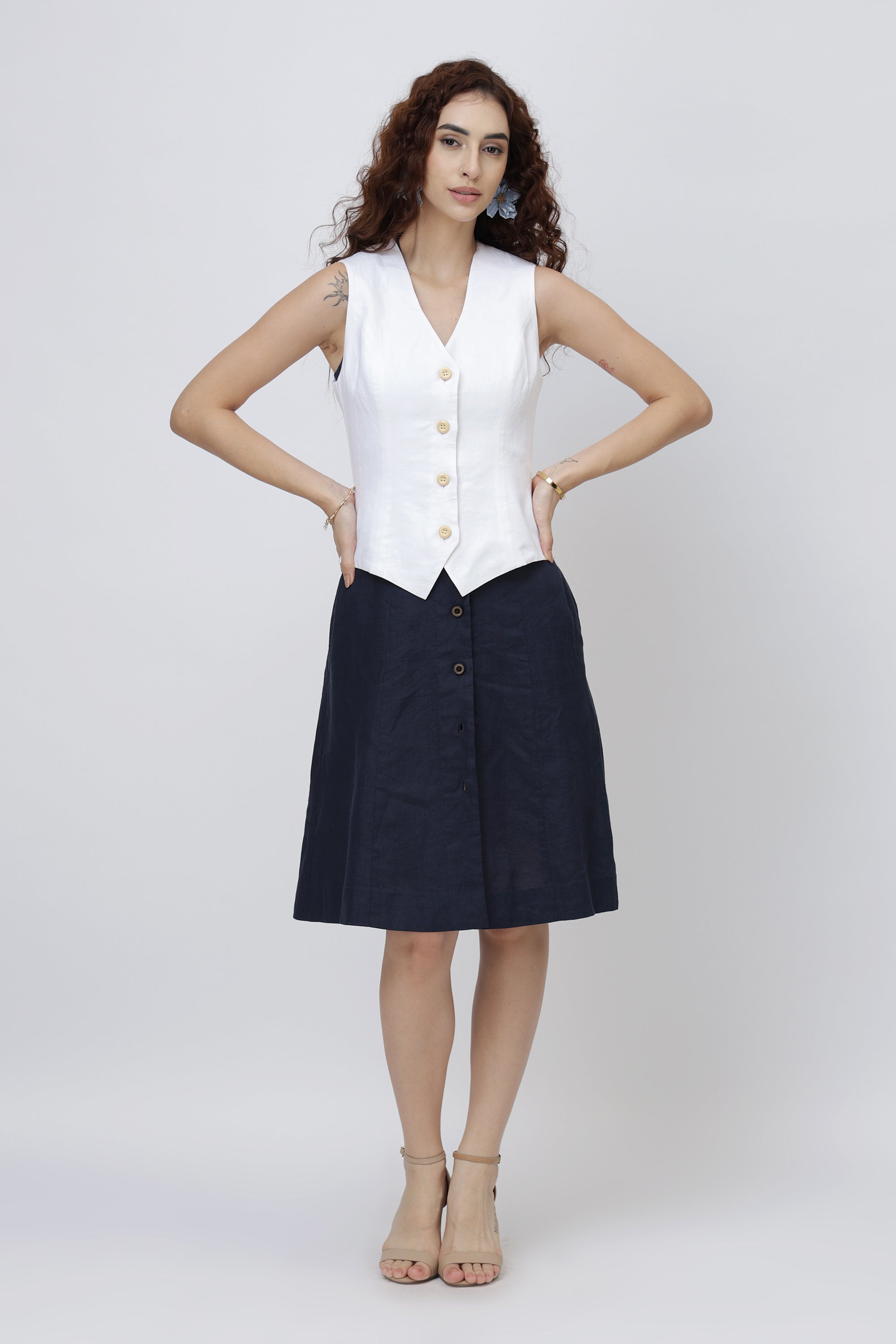 beautiful girl wearing a European linen vest top on a linen dress