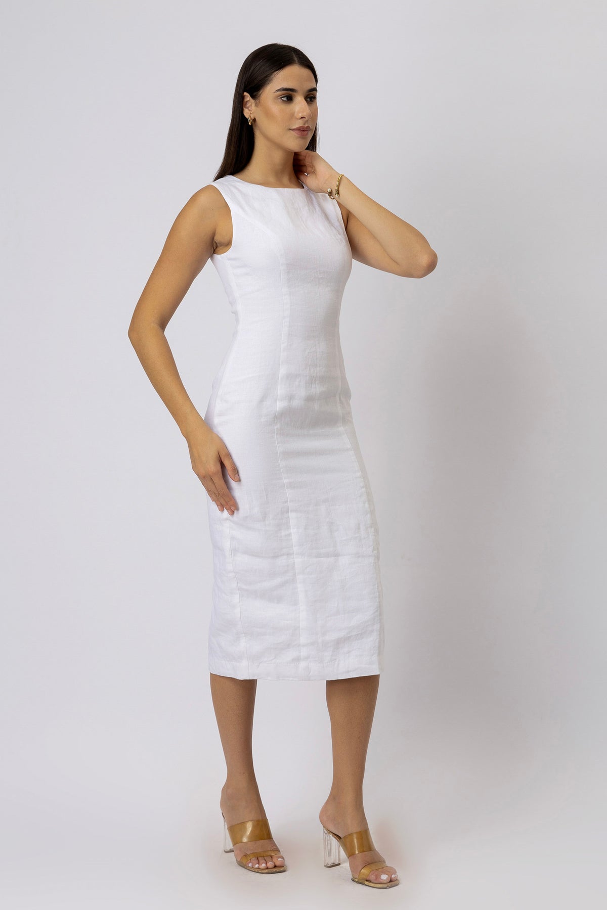 Angled view of tailored linen sheath dress