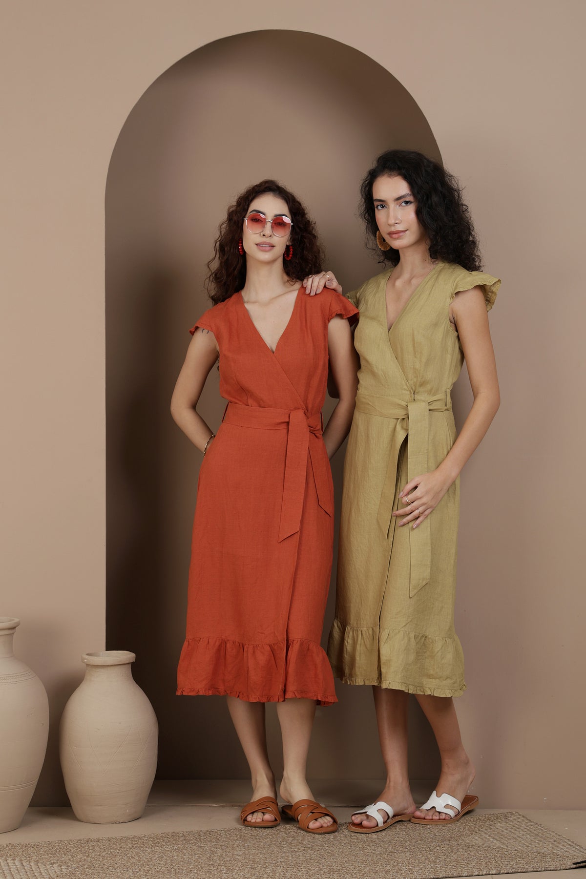 Two women in linen wrap dresses - different colors