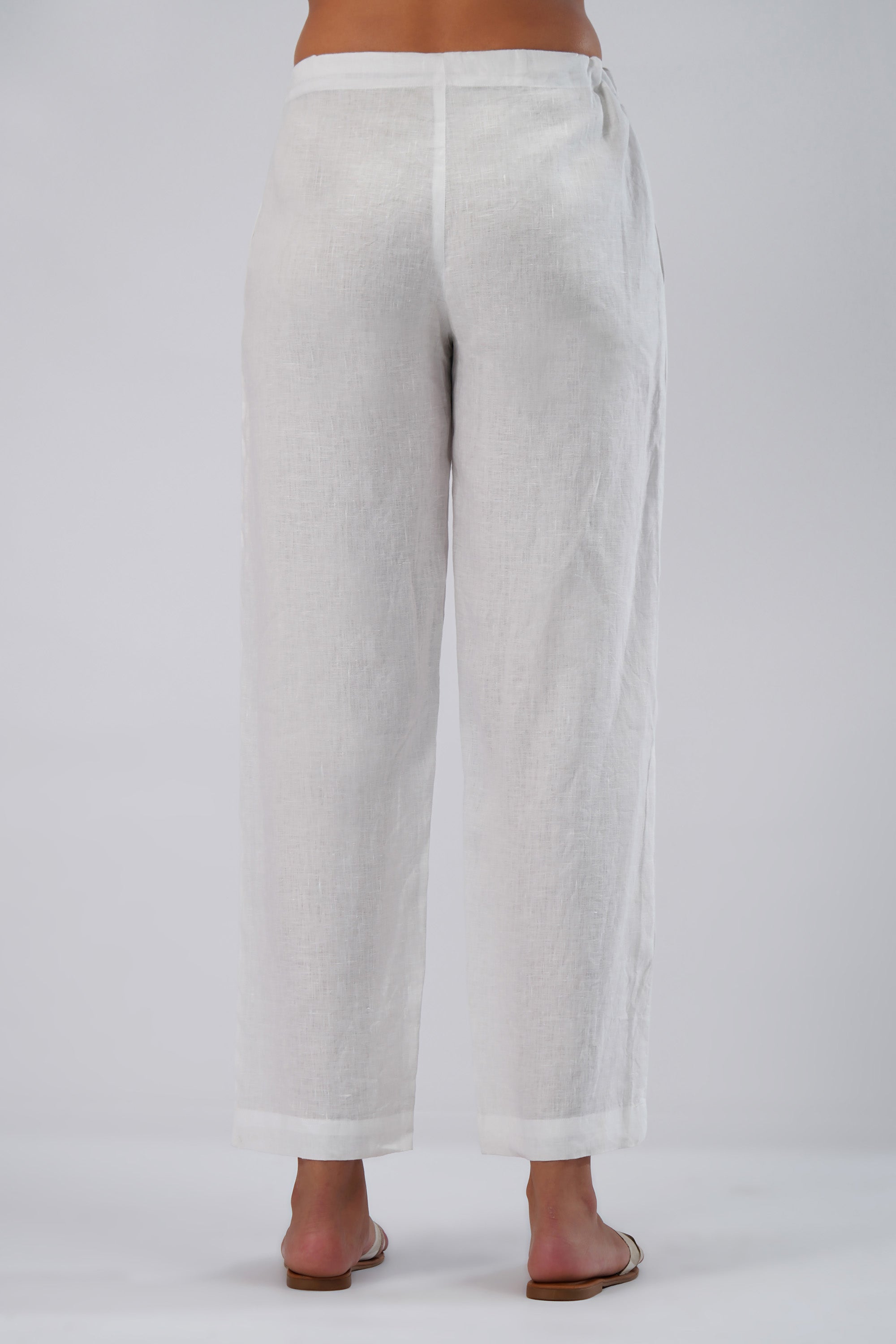 back view of white european linen pants with adjustable tie waist