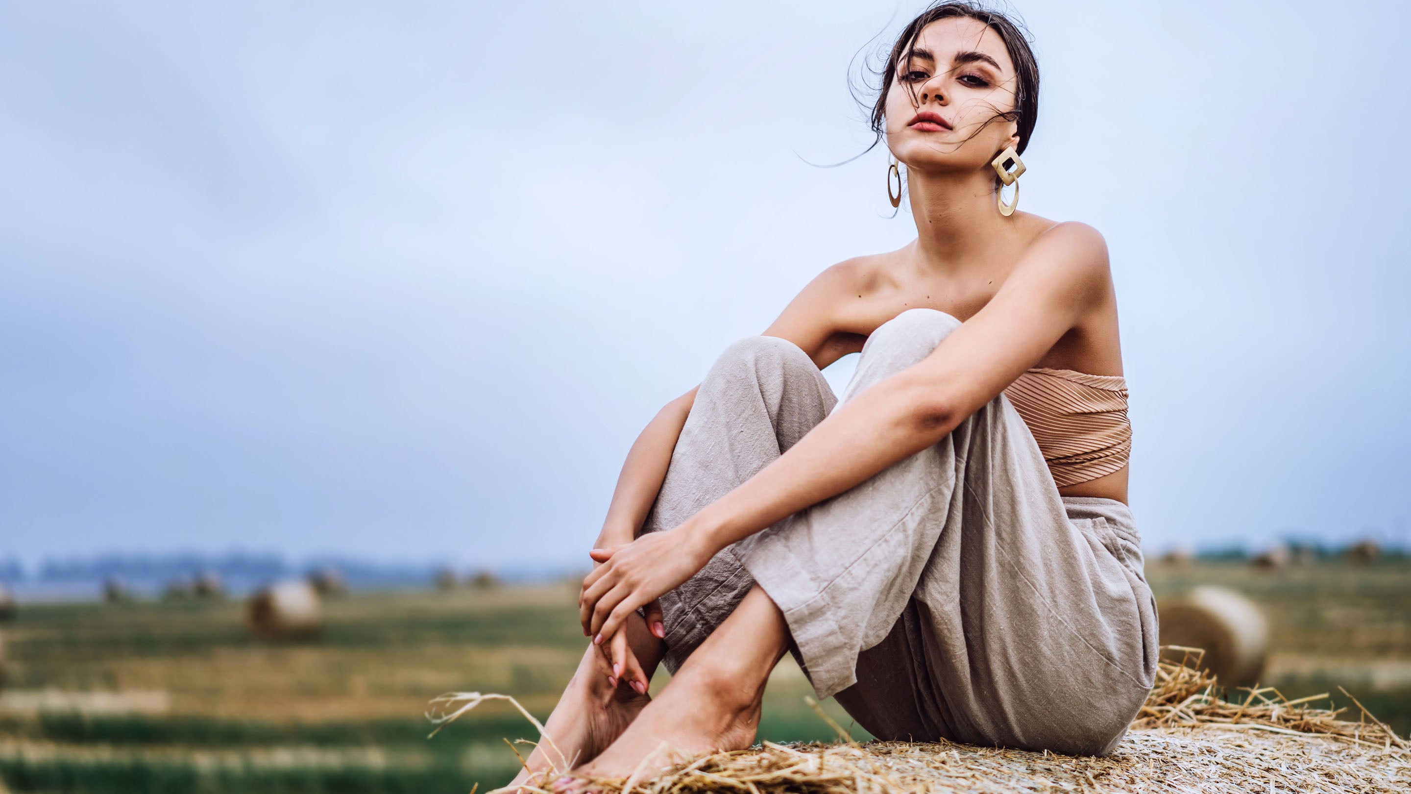 women in linen pants in the field