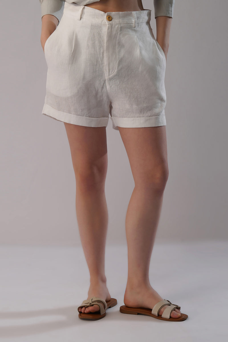 Women’s tailored linen shorts with cuffed hem and mid-rise waist in natural linen, front view